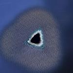 Този необикновен остров прилича на черна дупка в Google Earth